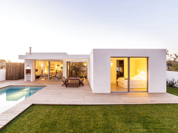 a house with a pool in the backyard