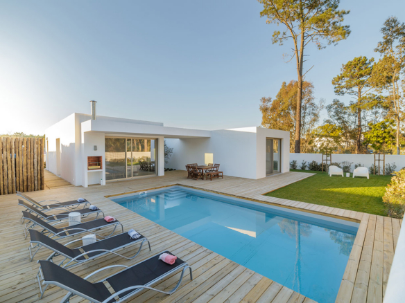 a house with a pool in the backyard