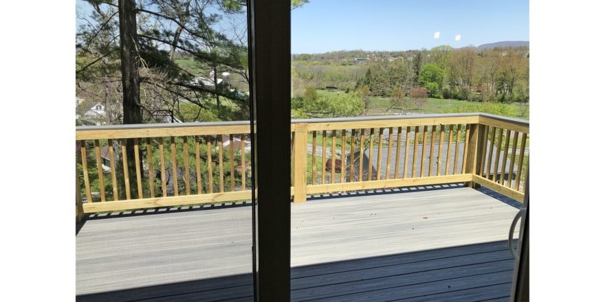 Screen door onto wooden back deck