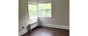 Unfurnished living room with wood-style flooring