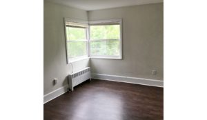 Unfurnished living room with wood-style flooring