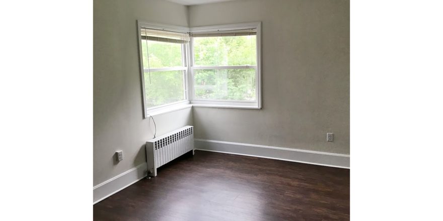 Unfurnished living room with wood-style flooring