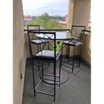 Balcony with bar-height table and chairs