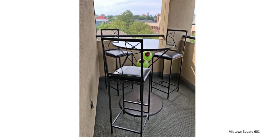 Balcony with bar-height table and chairs