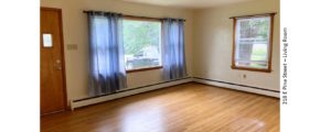 Unfurnished living room with hardwood floor and large picture window