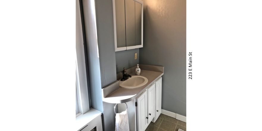 Bathroom with vanity and medicine cabinet with mirror