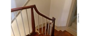 Stairwell with hardwood floors