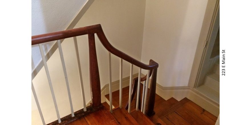 Stairwell with hardwood floors