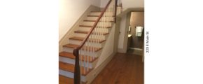 Entry hallway with wooden floors and stairs