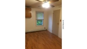 Room with ceiling fan, hardwood floors, window and closet