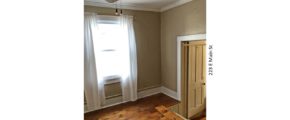 Room with steps up into it, ceiling fan, hardwood floors and window