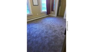 Unfurnished, carpeted bedroom with closet