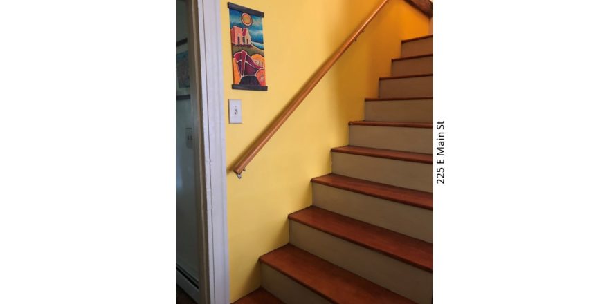 Staircases with railing of 225 E Main Street