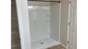 Bathroom with large shower stall and closet