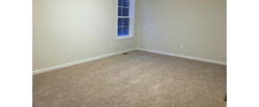 Unfurnished, carpeted bedroom