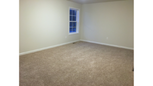 Unfurnished, carpeted bedroom
