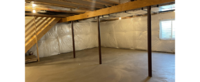 an unfinished room with exposed ceilings and wood beams