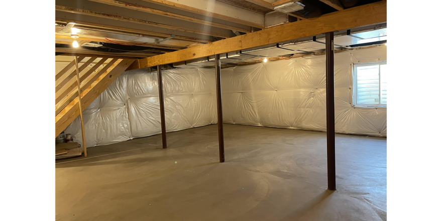 an unfinished room with exposed ceilings and wood beams