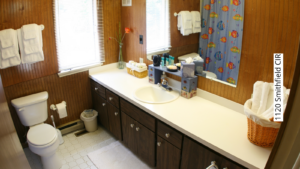 Bathroom with toilet and large vanity