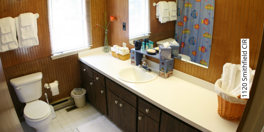 Bathroom with toilet and large vanity