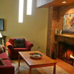 a living room filled with furniture and a fire place