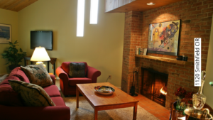 a living room filled with furniture and a fire place