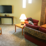 a living room filled with furniture and a fire place