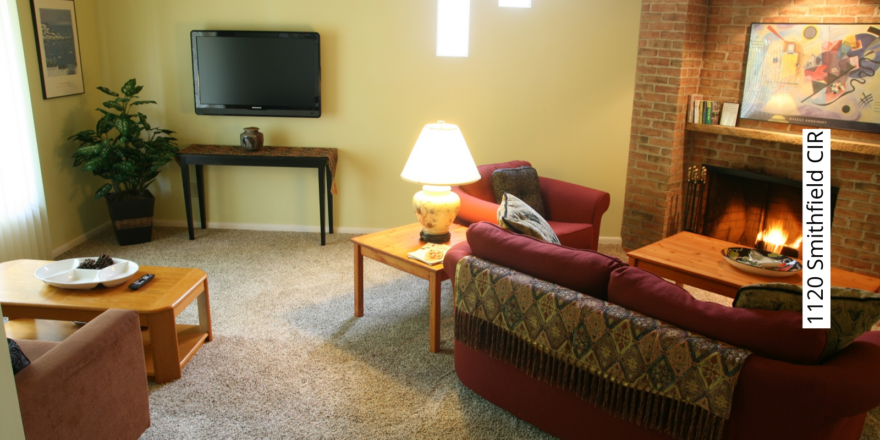 a living room filled with furniture and a fire place