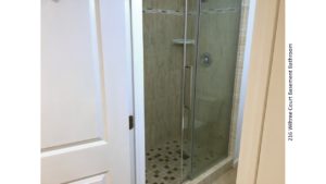 Shower stall with tile and sliding glass door
