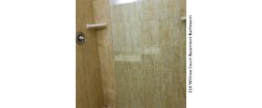 Shower stall with tile and sliding glass door