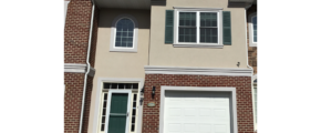 Exterior of townhouse with brick and stucco siding