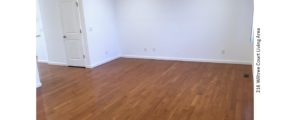 Living area with hardwood floors and window