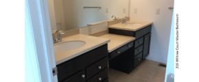 Bathroom with double sink vanity and large mirror