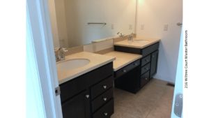 Bathroom with double sink vanity and large mirror