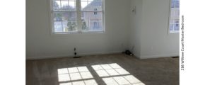 Unfurnished, carpeted bedroom with windows