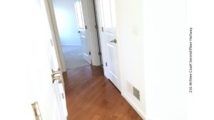 Hallway with wood floors