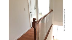 Hallway with wood floors