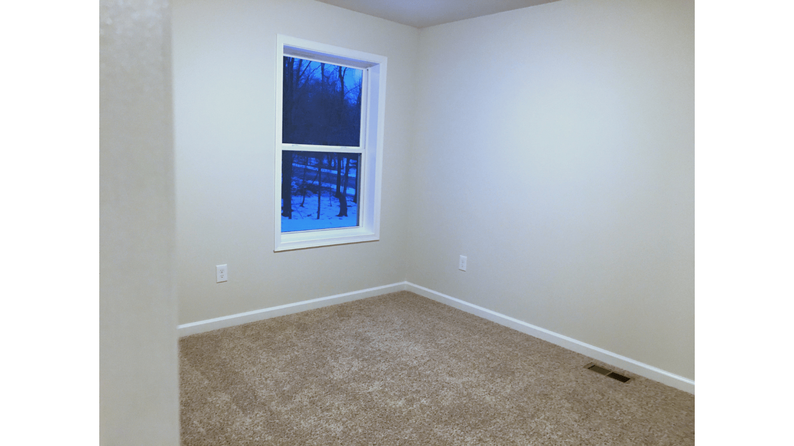 Empty room with window and carpet