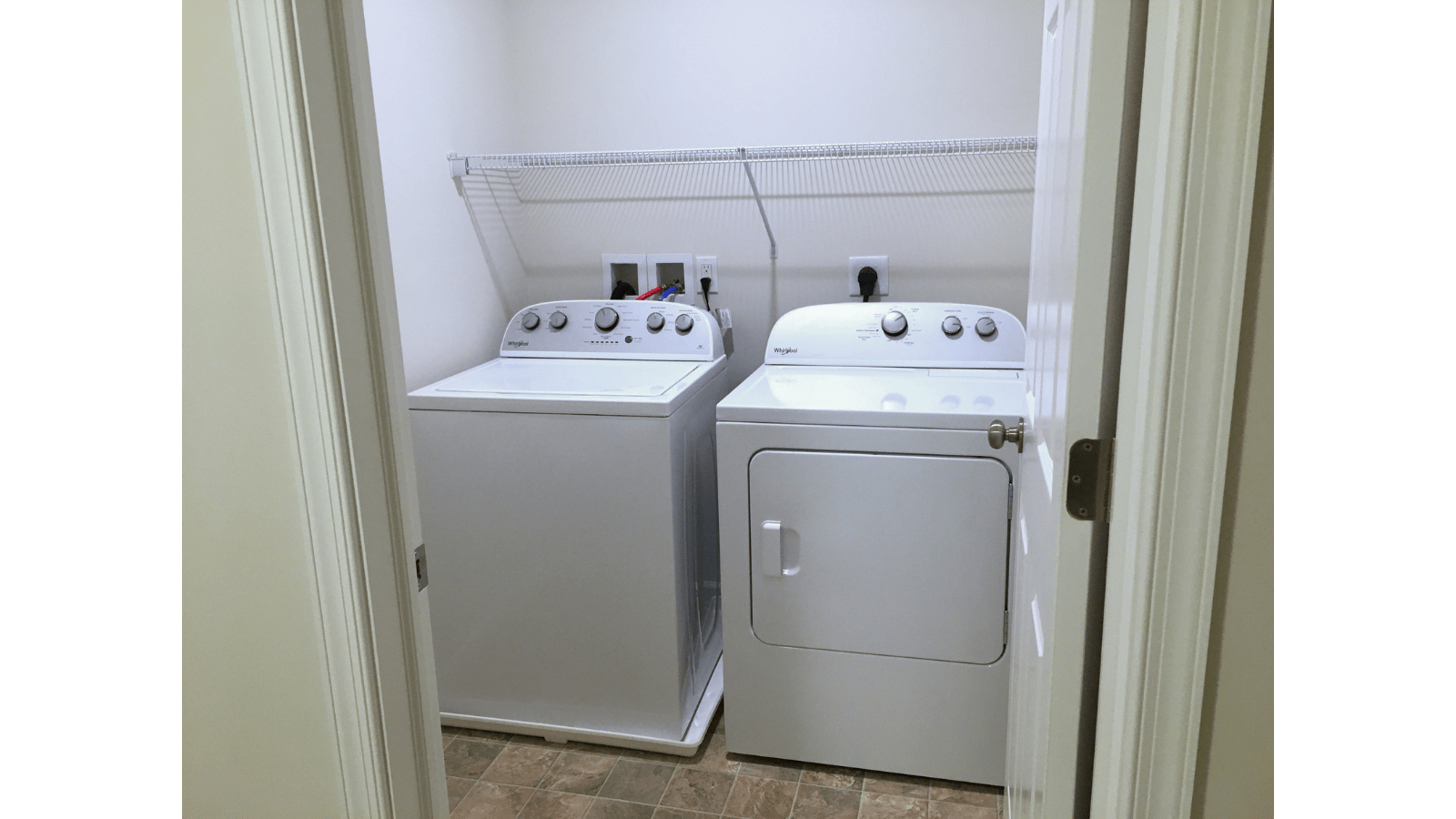 Whirlpool washer and dryer in laundry room