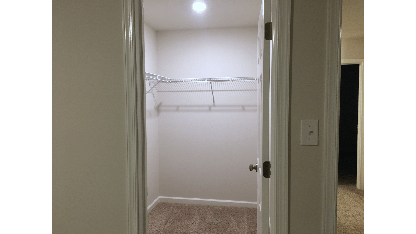 Empty walk-in closet with wire shelving