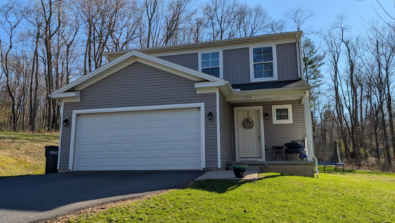 a house with a driveway in front of it