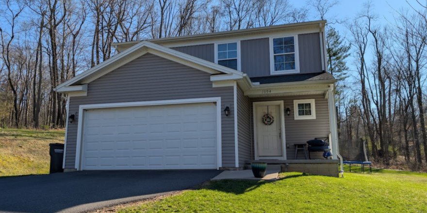 a house with a driveway in front of it