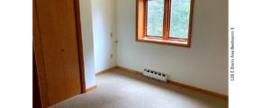 Unfurnished and carpeted bedroom with closet and crank windows