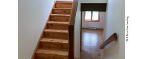 Stair landing with wood stairs and railings