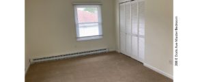 Unfurnished, carpeted bedroom with closet