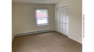 Unfurnished, carpeted bedroom with closet