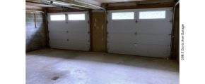 Garage with two garage doors.