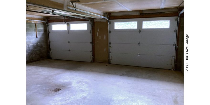 Garage with two garage doors.