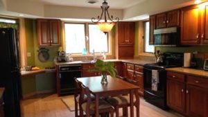 Kitchen with table and cabinets