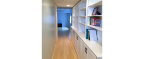 Hallway with large shelving unit